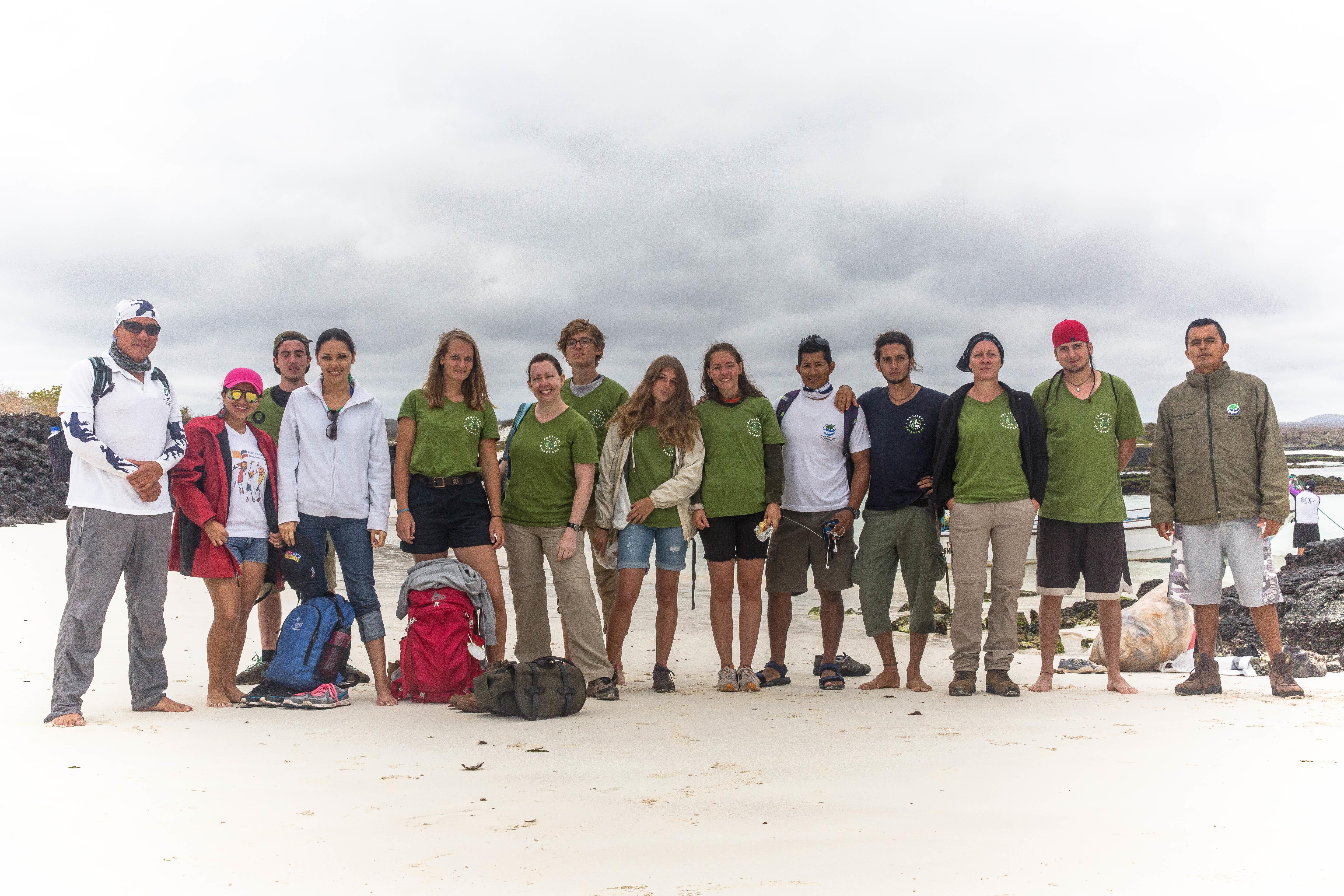 Volunteers from Projects Abroad assist with a beach clean up as part of their conservation volunteering in the Galapagos Islands. A picture of a group of volunteers from Projects Abroad assisting with a beach clean up during their conservation volunteering in the Galapagos Islands.
